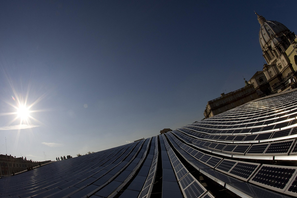 Solar panels are seen from the roof of the Paul VI audience hall at the Vatican in 2008. It was the first solar-generated electrical system installed at the Vatican. (CNS/Reuters/Tony Gentile)