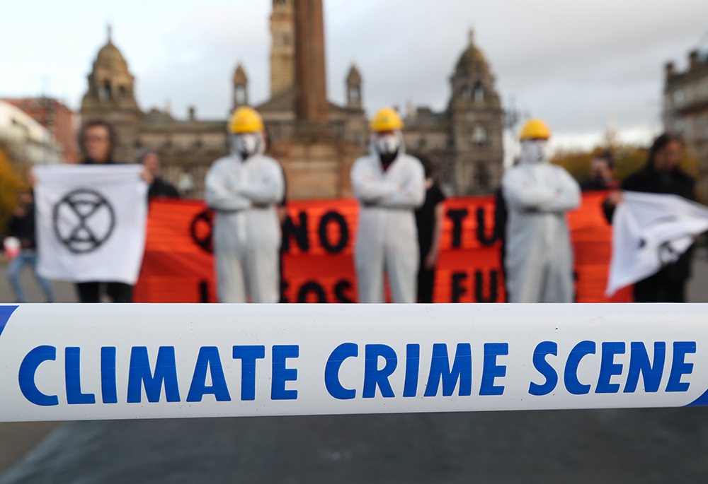 Protesters attend a demonstration against the fossil fuel industry Nov. 7, 2021, during the U.N. Climate Change Conference, known as COP26, in Glasgow, Scotland. (CNS/Reuters/Yves Herman)