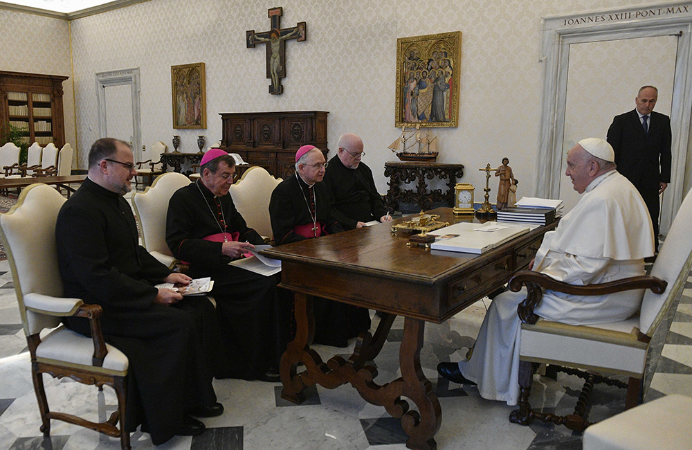 Pope Francis meets with the leadership of the U.S. Conference of Catholic Bishops in the library of the Apostolic Palace Oct. 13 at the Vatican. Pictured with the pontiff are Fr. Michael Fuller, general secretary; Detroit Archbishop Allen Vigneron, vice president; Archbishop José Gomez of Los Angeles, president; and Fr. Paul Hartmann, associate general secretary. (CNS/Vatican Media)
