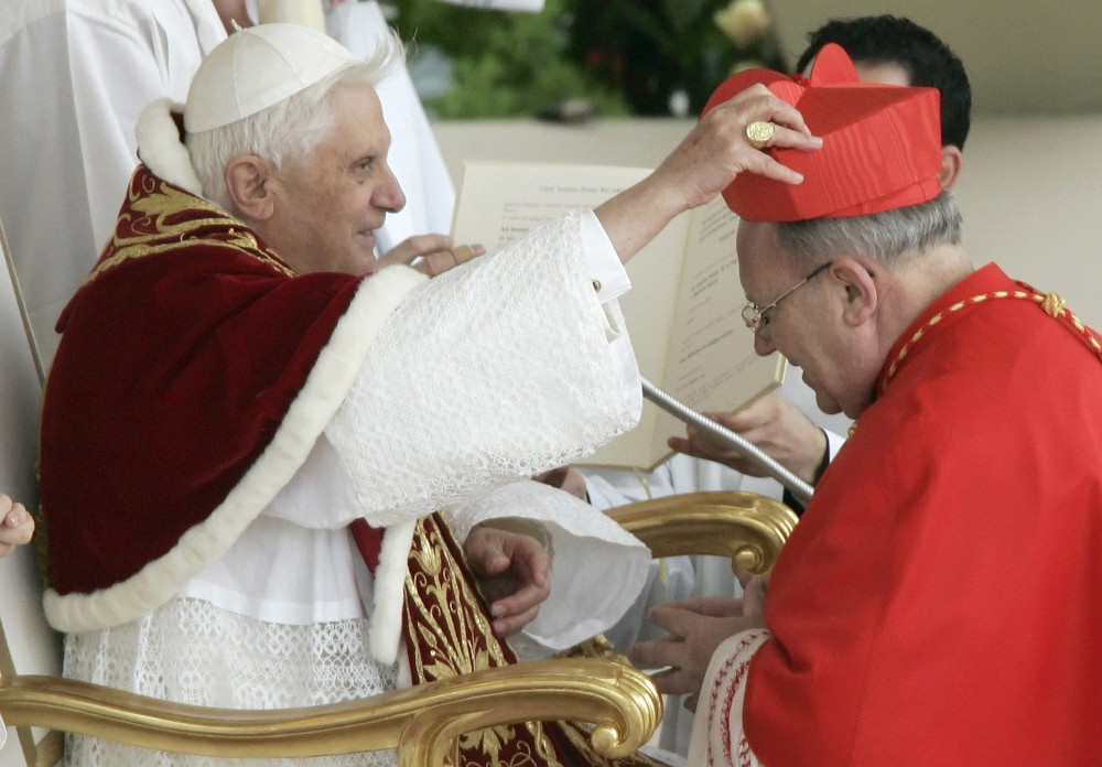 French Cardinal Jean-Pierre Ricard of Bordeaux receives his red hat from then-Pope Benedict XVI during his induction into the College of Cardinals at the Vatican March 24, 2006. The cardinal has admitted to abusing a 14-year-old girl 35 years ago. (CNS photo/Tony Gentile, Reuters)