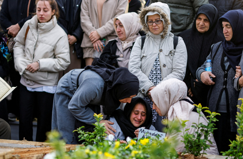 People in Istanbul attend the Nov. 14, 2022, funeral of Mukaddes Elif Topkara and Adem Topkara two of the six victims of a blast that took place Nov. 13 in a busy shopping district. 