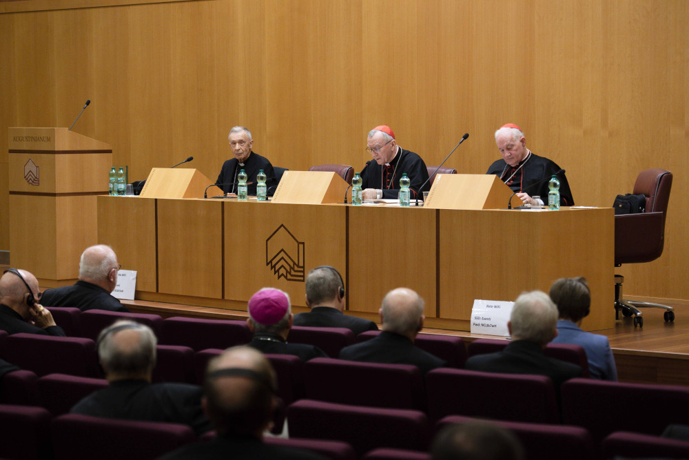 Curia officials -- Cardinal Luis Ladaria, prefect of the Dicastery for the Doctrine of the Faith; Cardinal Pietro Parolin, Vatican secretary of state; and Cardinal Marc Ouellet, prefect of the Dicastery for Bishops – meet Nov. 18, 2022, with the bishops of Germany making their "ad limina" visits to the Vatican. Other heads of Vatican dicasteries also attended the meeting across the street from the Vatican at the Augustinianum Institute for Patristic Studies. (CNS photo/Vatican Media)