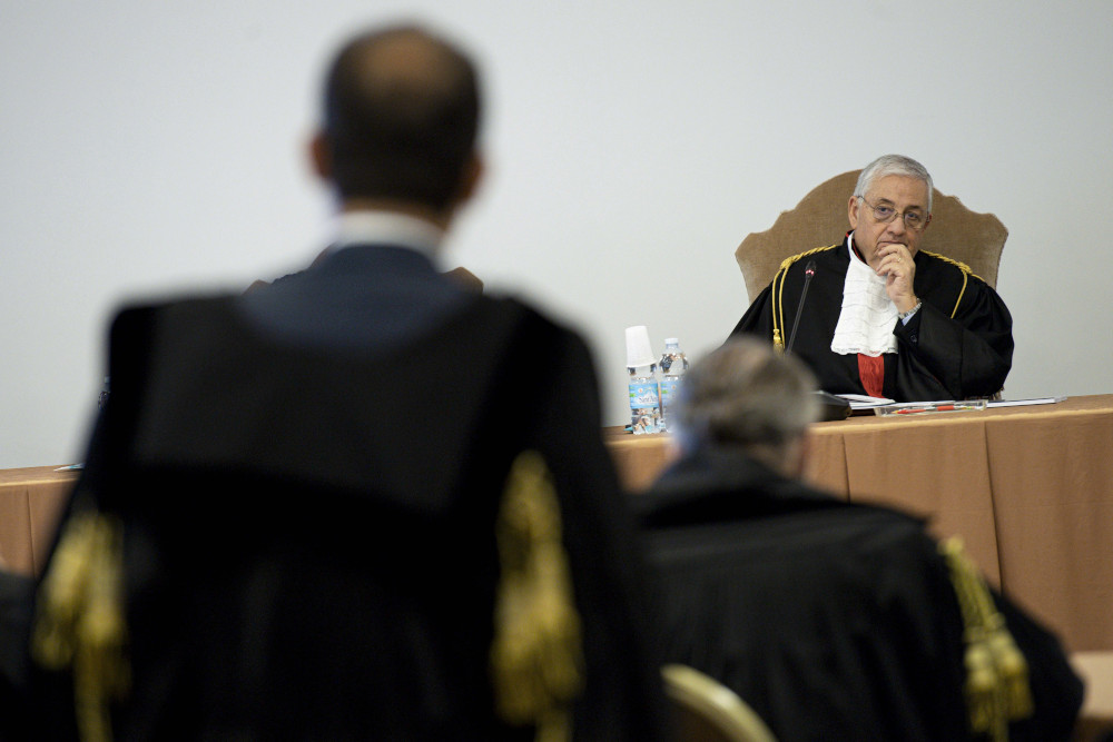 Vatican Judge Giuseppe Pignatone listens during the third session of the trial of six defendants -- including Cardinal Angelo Becciu -- accused of financial crimes at the Vatican City State criminal court Nov. 17, 2021. (CNS photo/Vatican Media)