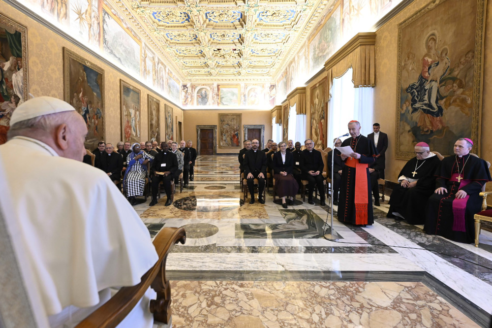 Pope Francis listens to Cardinal Luis Ladaria, prefect of the Dicastery for the Doctrine of the Faith and president of the International Theological Commission, during a meeting with commission members Nov. 24, 2022, in the Apostolic Palace of the Vatican. (CNS photo/Vatican Media)