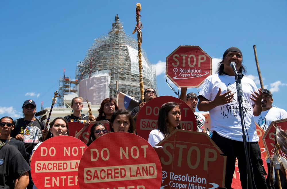 In this July 22, 2015, file photo, tribal councilman Wendsler Nosie Sr., right, speaks with Apache activists in a rally to save Oak Flat, land near Superior, Arizona, sacred to Western Apache tribes, in front of the U.S. Capitol in Washington. (AP/Molly Riley)