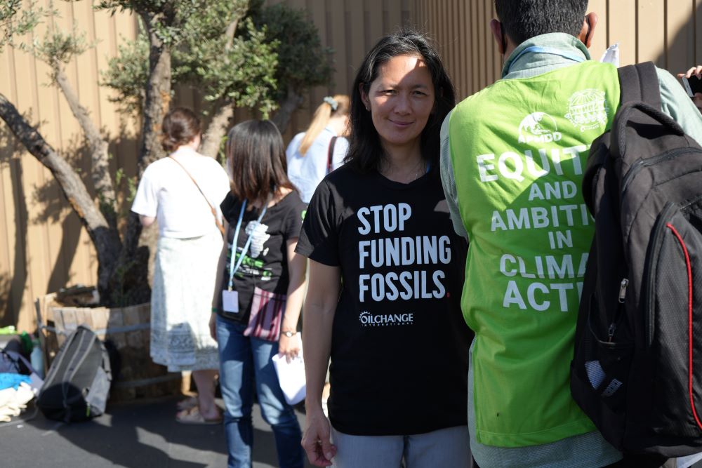 A protester wears a t-shirt with the message "Stop funding fossils" during a demonstration at the COP27 climate summit in Sharm el-Sheikh, Egypt, Nov. 9, 2022. (Doreen Ajiambo)