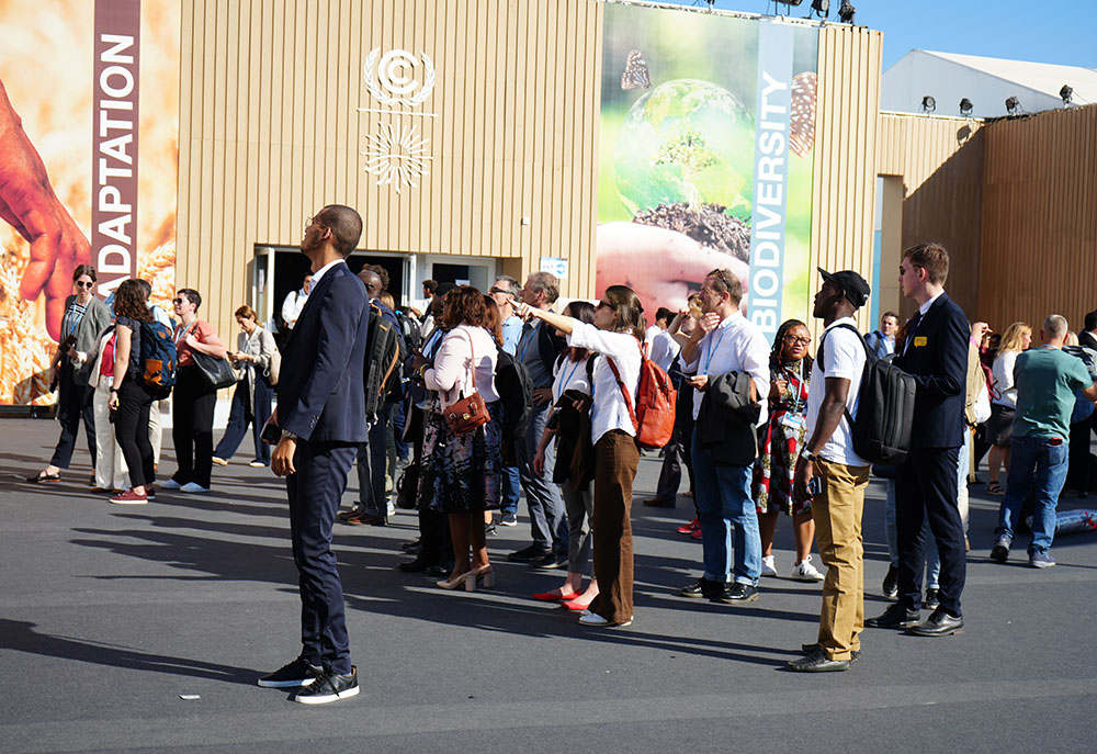 Participants of COP27 arrive at the convening in Sharm El Sheikh, Egypt, on Nov. 7. (EarthBeat photo/Doreen Ajiambo)