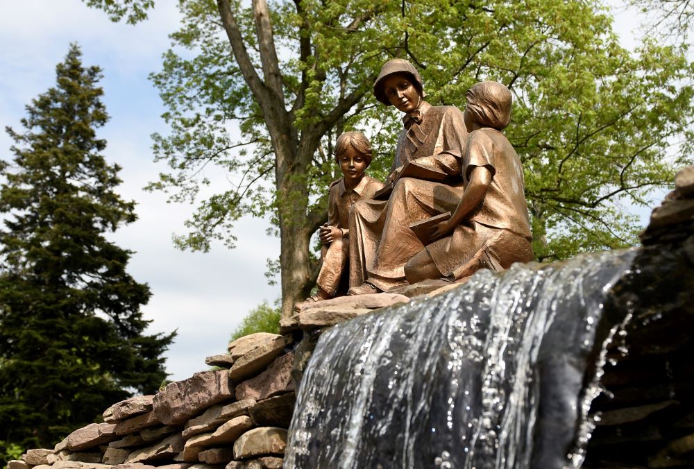 Statue of Mother Seton reading to children