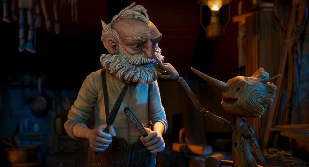 Gepetto (voiced by David Bradley) and Pinocchio (voiced by Gregory Mann) interact in a scene from "Guillermo del Toro's Pinocchio." (Netflix © 2022)