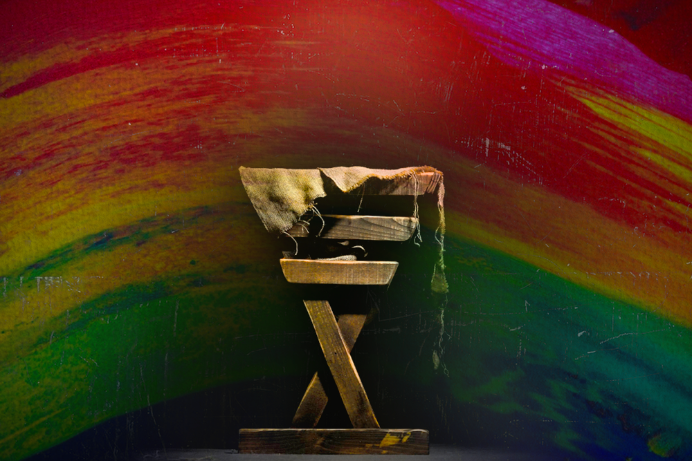 Illustration shows wooden structure against a rainbow background.