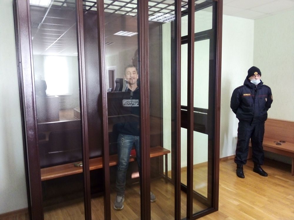 Vitold Ashurak, a prominent Catholic protester, is seen in a glassed room during his trial in Lida, Belarus, Jan. 18, 2021. Ashurak was jailed and died while in custody. (CNS/Courtesy of Volha Bykouskaya)