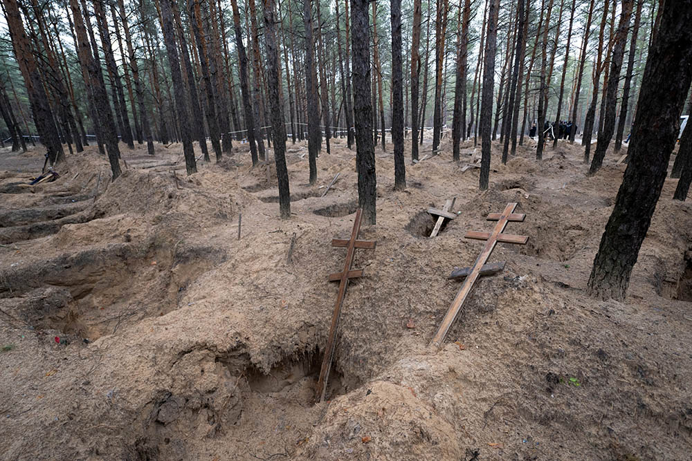 The site of more than 400 mass graves in Izium, Ukraine, is seen on Dec. 8. (Marcin Mazur)