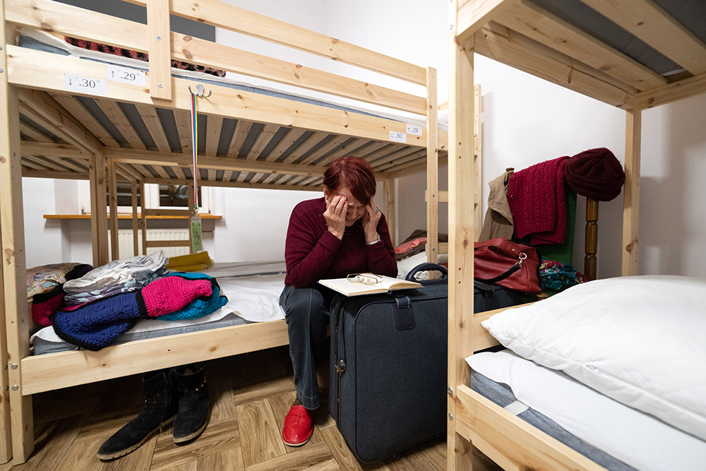 A refugee from Bucha, Ukraine, at the Greek Catholic Cathedral in Przemyśl, Poland, on Dec. 6 (Marcin Mazur)