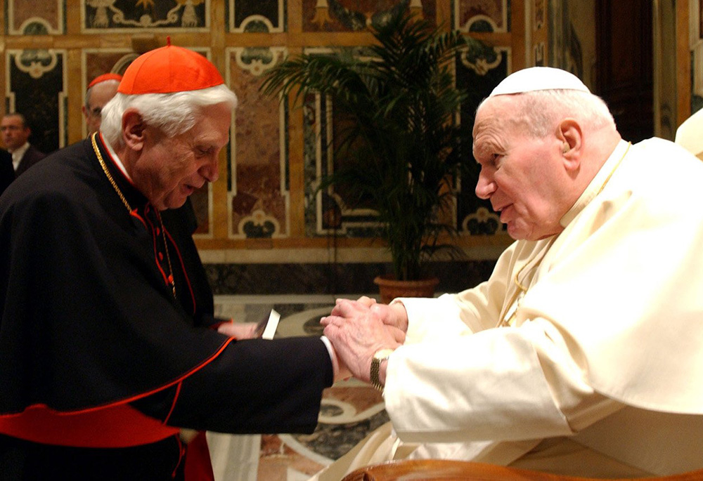 Cardinal Joseph Ratzinger, who later became Pope Benedict XVI, greets Pope John Paul II during a ceremony at the Vatican in this Feb. 6, 2004, file photo. (CNS/Catholic Press photo) 