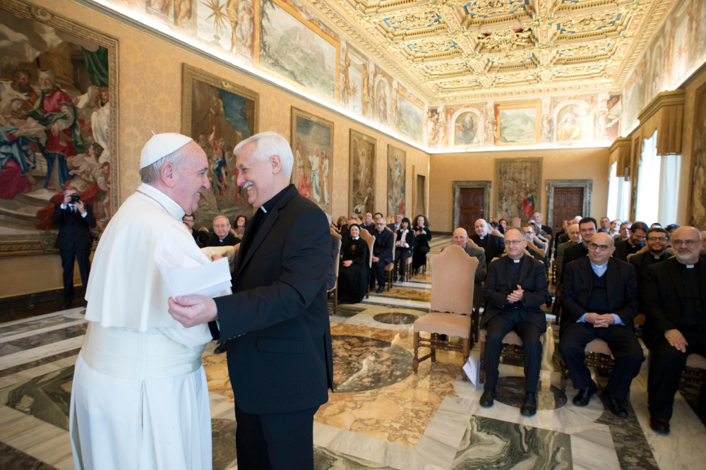 Pope Francis embraces Fr. Arturo Sosa, superior general of the Society of Jesus, during a meeting with editors and staff of the Jesuit-run magazine, La Civilta Cattolica, at the Vatican Feb. 9, 2017. (CNS photo/L'Osservatore Romano, handout)