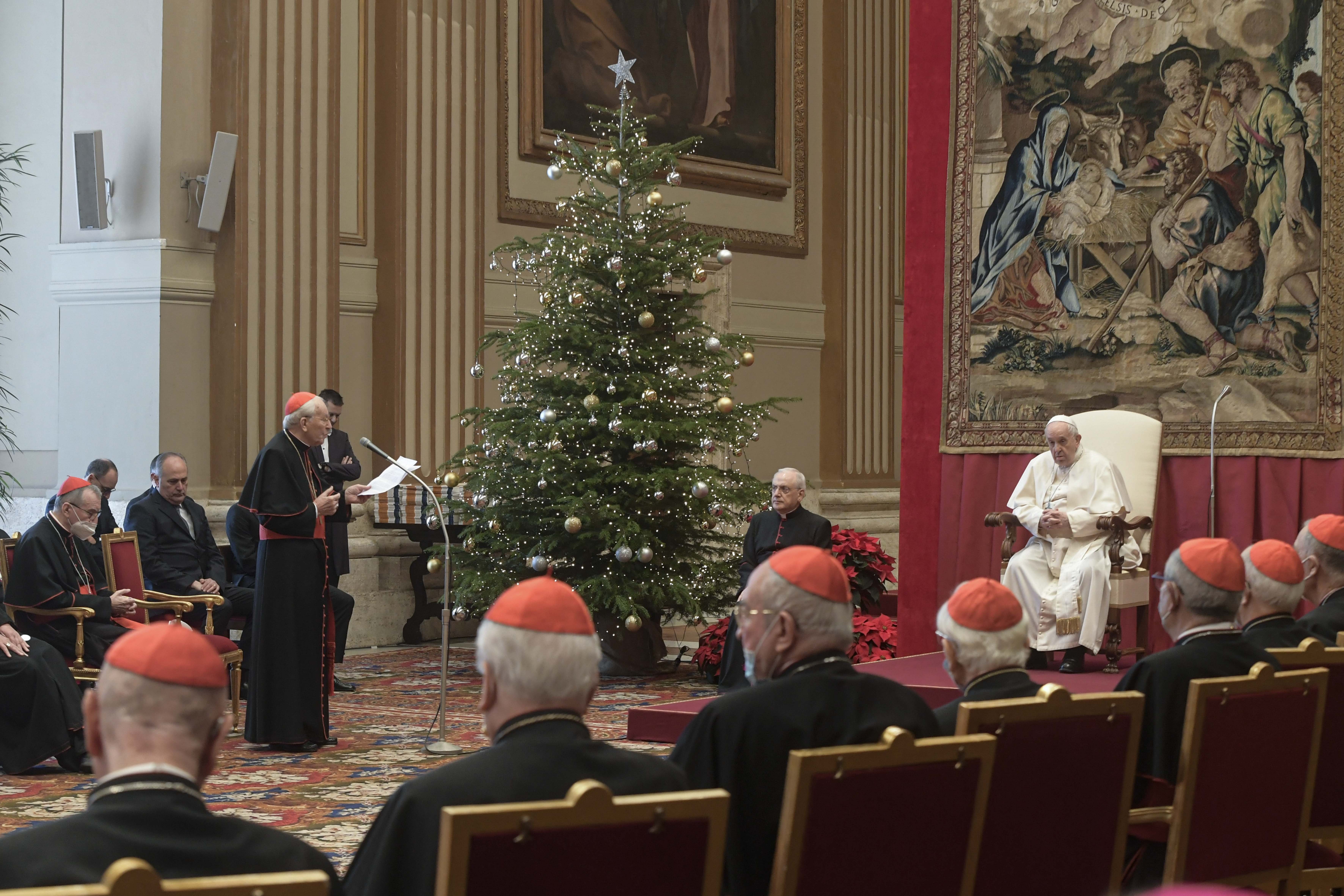Cardinal Giovanni Battista Re, dean of the College of Cardinals, offers Pope Francis best wishes for Christmas on behalf of the cardinals and top officials of the Roman Curia during an audience in the Apostolic Palace at the Vatican Dec. 23, 2021. (CNS photo/Vatican Media)