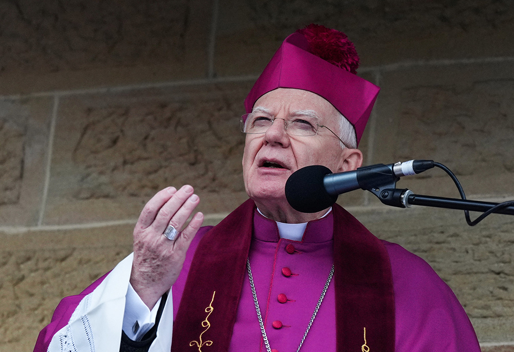 Archbishop Marek Jedraszewski of Krakow, Poland, speaks during the Way of the Cross on Good Friday, April 15, 2022, in Kalwaria Zebrzydowska. (CNS/Reuters/Aleksandra Szmigiel)