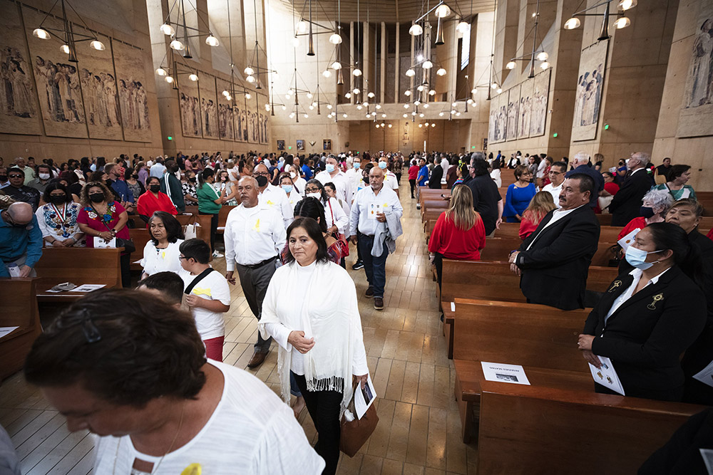 Volunteers and ministries serving immigrants from the Southern California archdioceses of Los Angeles, Orange, San Diego and San Bernardino process into the annual Mass in Recognition of All Immigrants at the Cathedral of Our Lady of the Angels Sept. 18. (CNS/Angelus News/Victor Alemán)