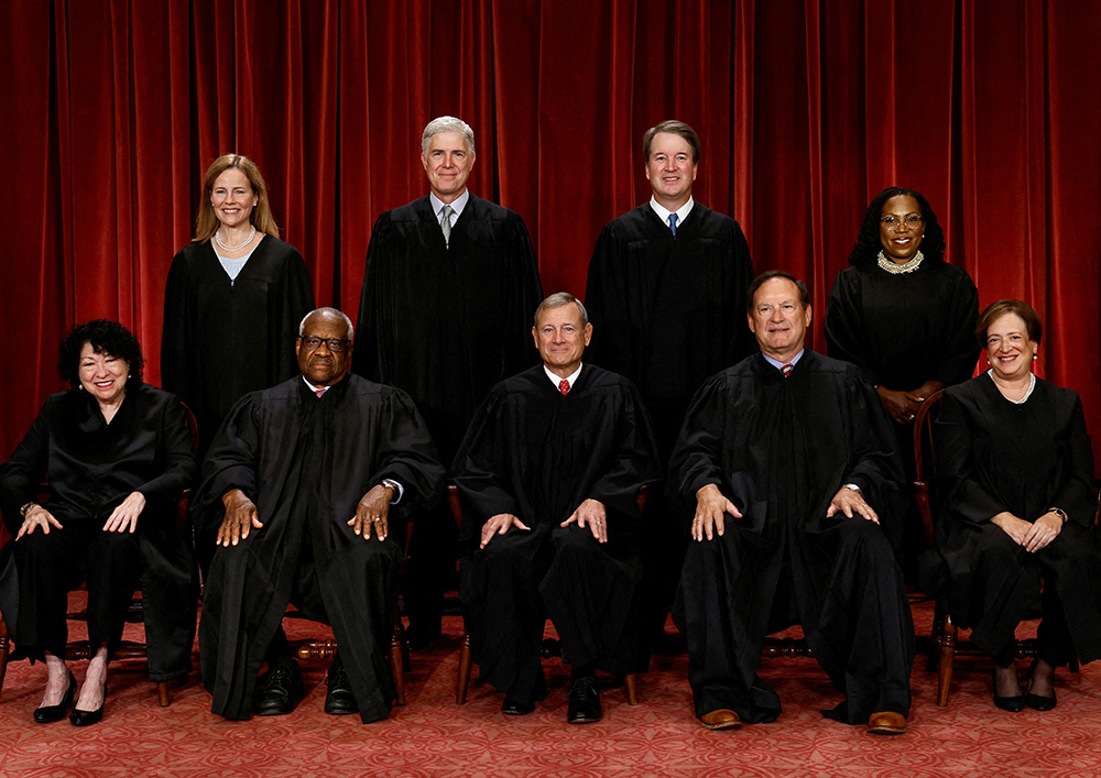 U.S. Supreme Court justices pose for their group portrait at the Supreme Court in Washington Oct. 7, 2022. Seated from left are Justices Sonia Sotomayor and Clarence Thomas, Chief Justice of the United States John Roberts, and Justices Samuel Alito and Elena Kagan. Standing from left are Justices Amy Coney Barrett, Neil Gorsuch, Brett Kavanaugh and Ketanji Brown Jackson. (CNS/Reuters/Evelyn Hockstein)