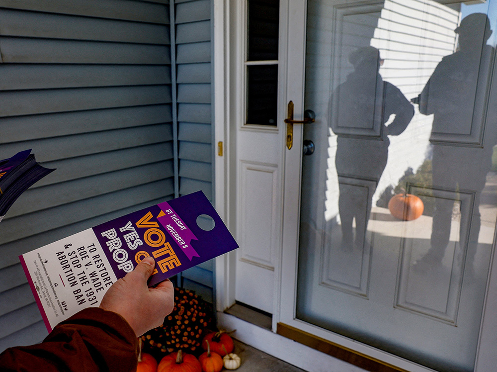 People in Dewitt, Michigan, canvass a neighborhood Nov. 7, 2022, in support of Proposal 3, a ballot measure to codify a right to an abortion. The measure was approved by 56% of voters in the Nov. 8 midterms. (CNS/Reuters/Evelyn Hockstein)