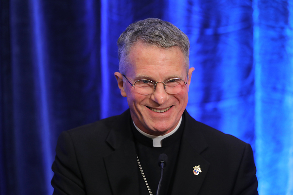 Archbishop Timothy Broglio of the U.S. Archdiocese for the Military Services smiles during a Nov. 15 news conference after being elected president of the U.S. Conference of Catholic Bishops during the fall general assembly of the bishops in Baltimore. (CNS/Bob Roller)