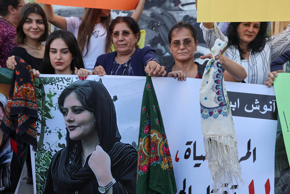 Women take part in a rally in Beirut Sept. 21, days after the Iranian authorities announced the death of Mahsa Amini, 22, who died after being arrested in Tehran for allegedly wearing a hijab or headscarf in an "improper" way. (CNS/Reuters/Mohamed Azakir)