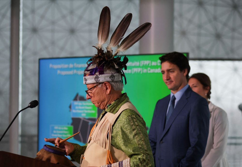 Elder Ka'nahsohon Kevin Deer performs a ceremony prior to Canadian Prime Minister Justin Trudeau making an announcement supporting Indigenous-led conservation during COP15, U.N. Biodiversity Conference, in Montreal Dec. 7, 2022. (CNS/Reuters/Christinne Muschi)