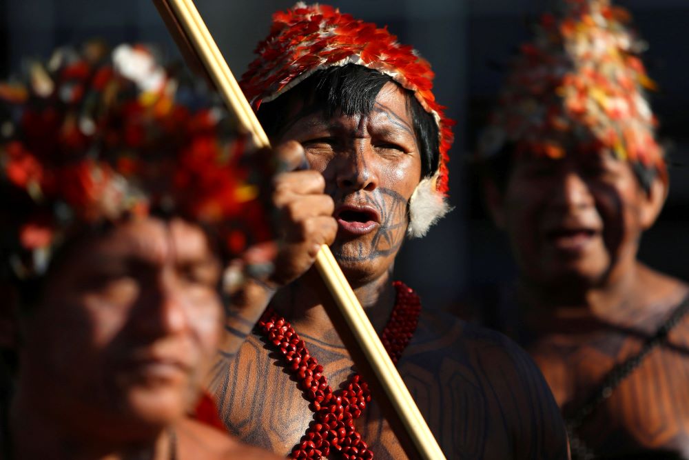 Indigenous people from the Munduruku tribe are pictured in a file photo during a demonstration in Brasilia, Brazil, to request demarcation of Indigenous lands in the Amazon rainforest. (CNS/Reuters/Adriano Machado)