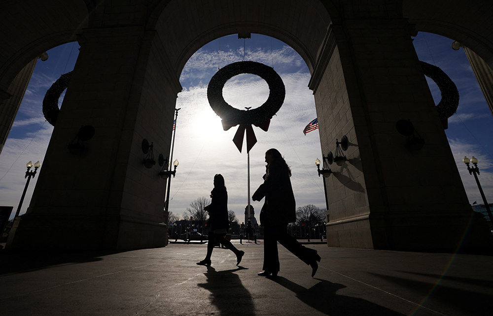 Women pass beneath Christmas wreaths outside Union Station in Washington, D.C., Dec. 19. (CNS/Reuters/Kevin Lamarque)