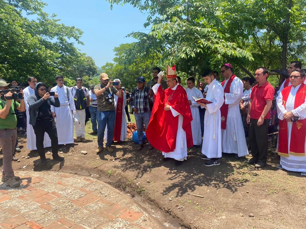 Salvadoran Cardinal Gregorio Rosa Chavez gives a blessing May 14, 2022, at the burial place that holds some of the remains of hundreds of peasants massacred in 1980 near the Sumpul River near Las Aradas, El Salvador.  (CNS/courtesy Father Manuel Acosta)