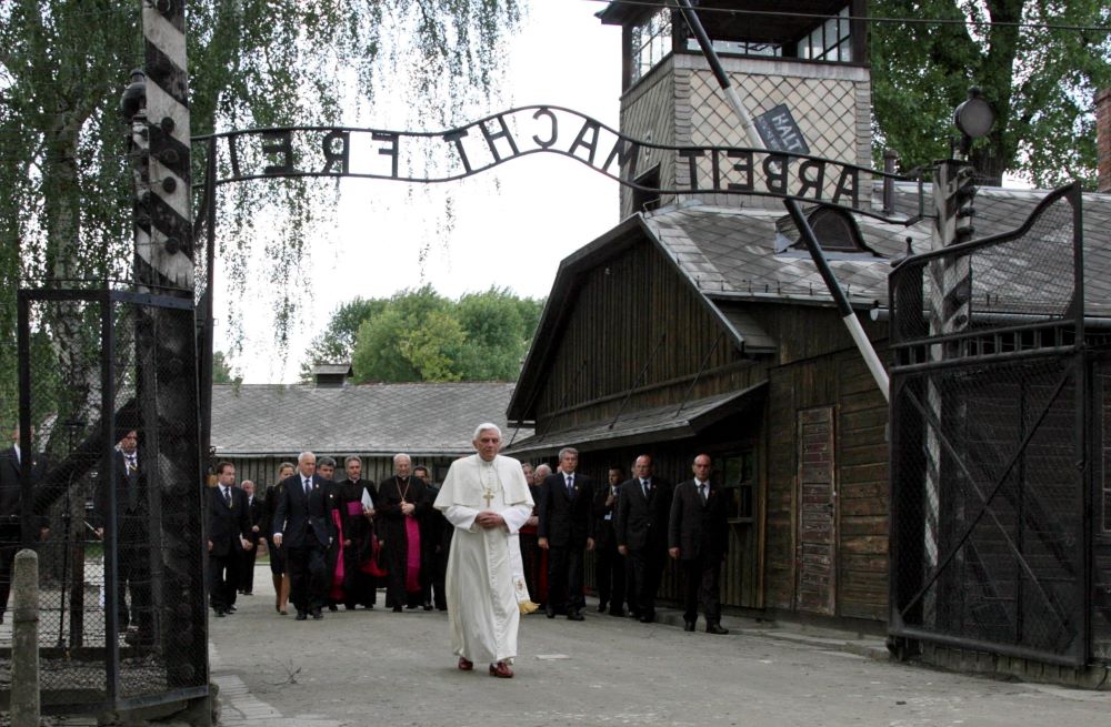 Pope Benedict XVI walks through the gate of Auschwitz, the former Nazi death camp in Poland.