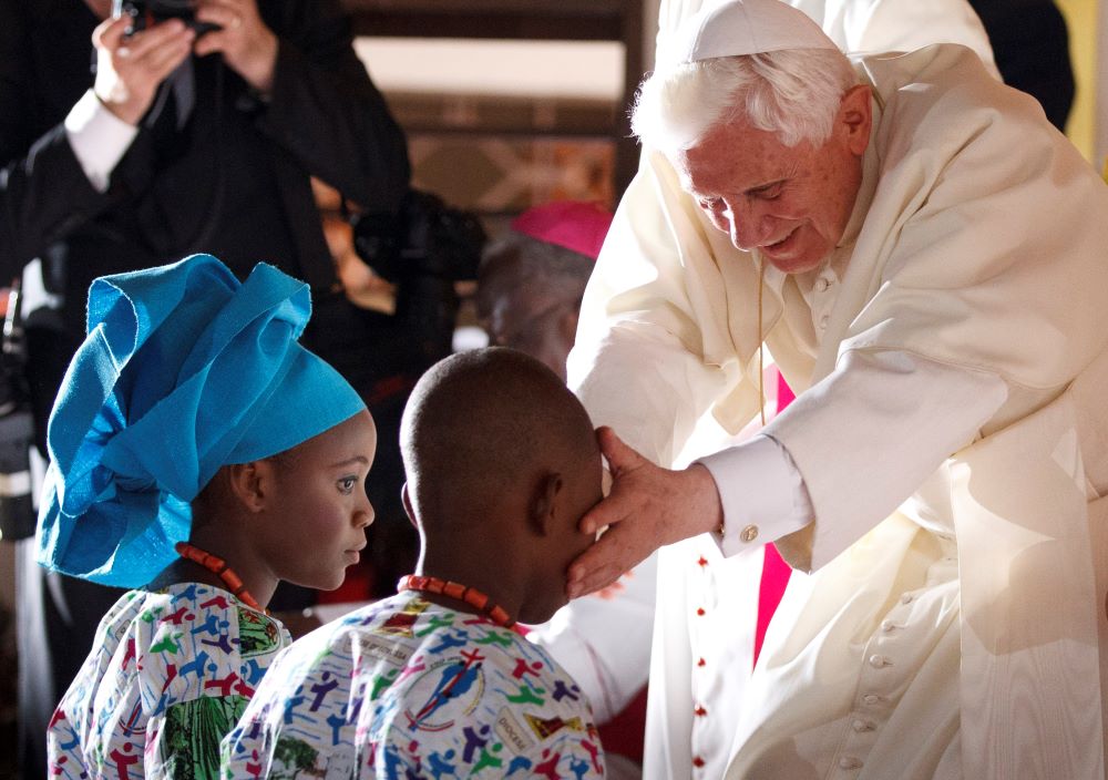 Pope Benedict XVI greets youths at the Missionaries of Charity Peace and Joy Center in Cotonou, Benin, Nov. 19, 2011. (CNS/Paul Haring)