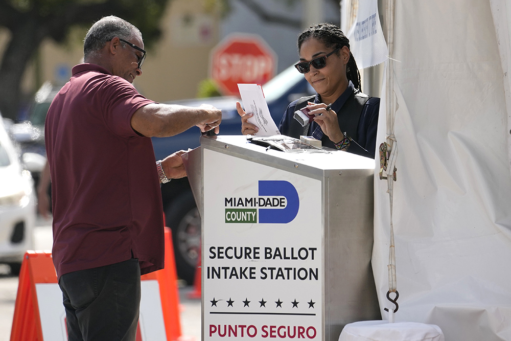 Employees process vote-by-mail ballots for the midterm election at the Miami-Dade County Elections Department Nov. 8, 2022, in Miami. (AP/Lynne Sladky, File)