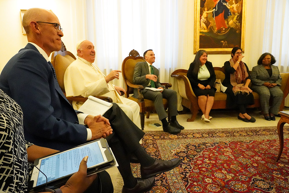 Members of the West/Southwest Industrial Areas Foundation network, including Colorado-based organizer Jorge Montiel, left, share a laugh with the pope during a 90-minute meeting with the pontiff in Rome. "For the pope to spend that type of time with organizers from the United States, it's rededicated us to organizing and staying in the fray," said Joe Rubio, national IAF co-director for the West/Southwest. (Courtesy West/Southwest Industrial Areas Foundation)