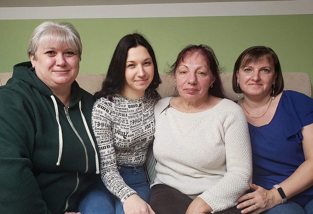 Four Ukrainian refugee women living in Jesuit seminary housing in Warsaw say they are ending a turbulent year safe, secure and calm — though still uneasily in exile. From left to right, the women are: Nadia Zhihalko, 46; Katya Zelinska, 27; Lubov Kadura, 67; and Yanyna Vasyk, 37. (NCR photo/Chris Herlinger)