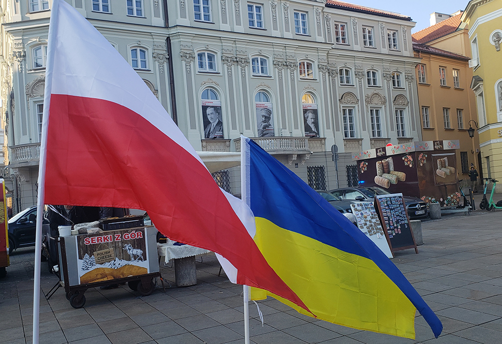 Polish and Ukrainian flags seen on a street of Warsaw's Old Town prior to Christmas. Despite historical tensions, observers say the two countries view Russia, which invaded Ukraine in February, as a common enemy and as a result, are improving relations with each other. (NCR photo/Chris Herlinger)