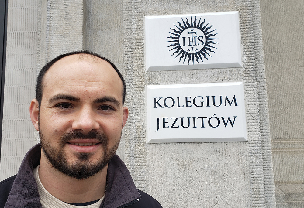 Sebastian Lelek, a Jesuit seminarian in Warsaw, outside the campus of Catholic Academy in Warsaw — Collegium Bobolanum, whose campus includes a Jesuit seminary and the St. Andrew Bobola Sanctuary. The Jesuits are providing housing for 11 arrivals from Ukraine: five women, two men and four children. (NCR photo/Chris Herlinger)