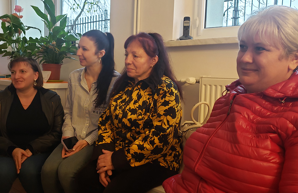 Four Ukrainian refugee women in the offices of Jesuit Refugee Service in Warsaw remain From left to right they are: Yanyna Vasyk, 37; Katya Zelinska, 27; Lubov Kadura, 67; and Nadia Zhihalko, 46. (NCR photo/Chris Herlinger)