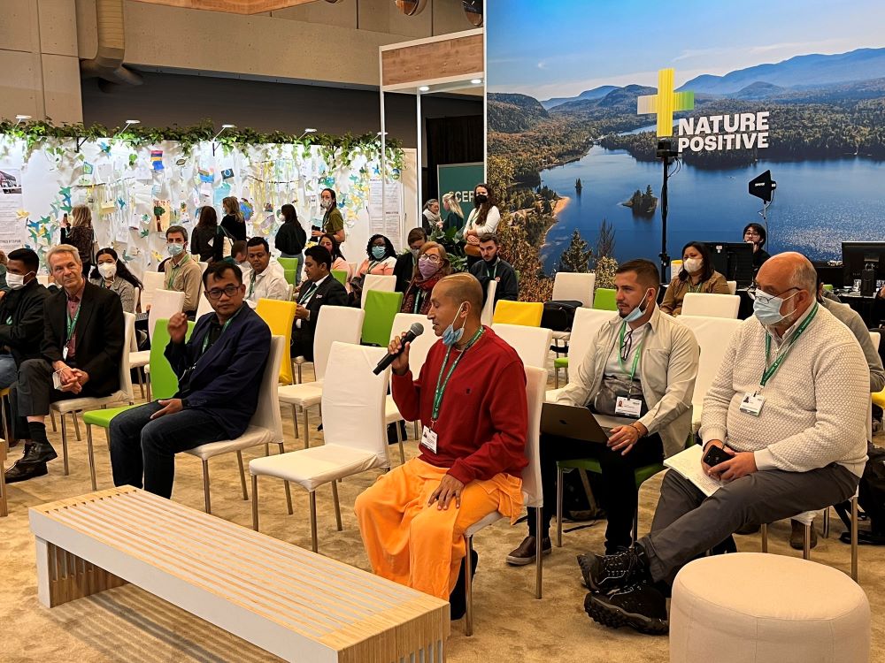 Gauranga Das, director of the ISKCON Govardhan Ecovillage, asks a question to a faith panel at an event Dec. 8 at the COP15 United Nations biodiversity conference, in Montreal. (Faiths at COP15/Wesley Cocozello)