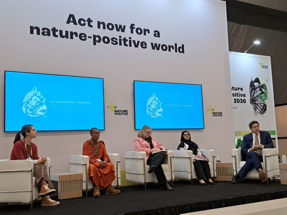 Representatives of world religions speak about faith priorities for negotiations at the United Nations biodiversity conference, COP15, during at event at the summit Dec. 8. Pictured, from left, are Alexandra Masako Goossens-Ishii of Soka Gakkai International; Venerable Tho Thoross of the Monk Community Forest; Amy Echeverria of the Missionary Society of St. Columban; Husna Ahmad  of Global One 2015; and Chris Elisarsa of World Evangelical Alliance. (Faiths at COP15/Wesley Cocozello)