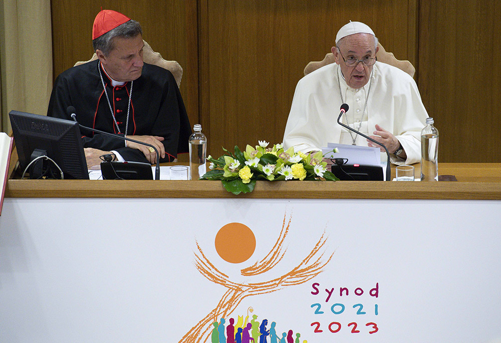 Pope Francis speaks as Maltese Cardinal Mario Grech, secretary-general of the Synod of Bishops, looks on during a meeting with representatives of bishops' conferences from around the world at the Vatican in this Oct. 9, 2021, file photo. (CNS/Paul Haring)