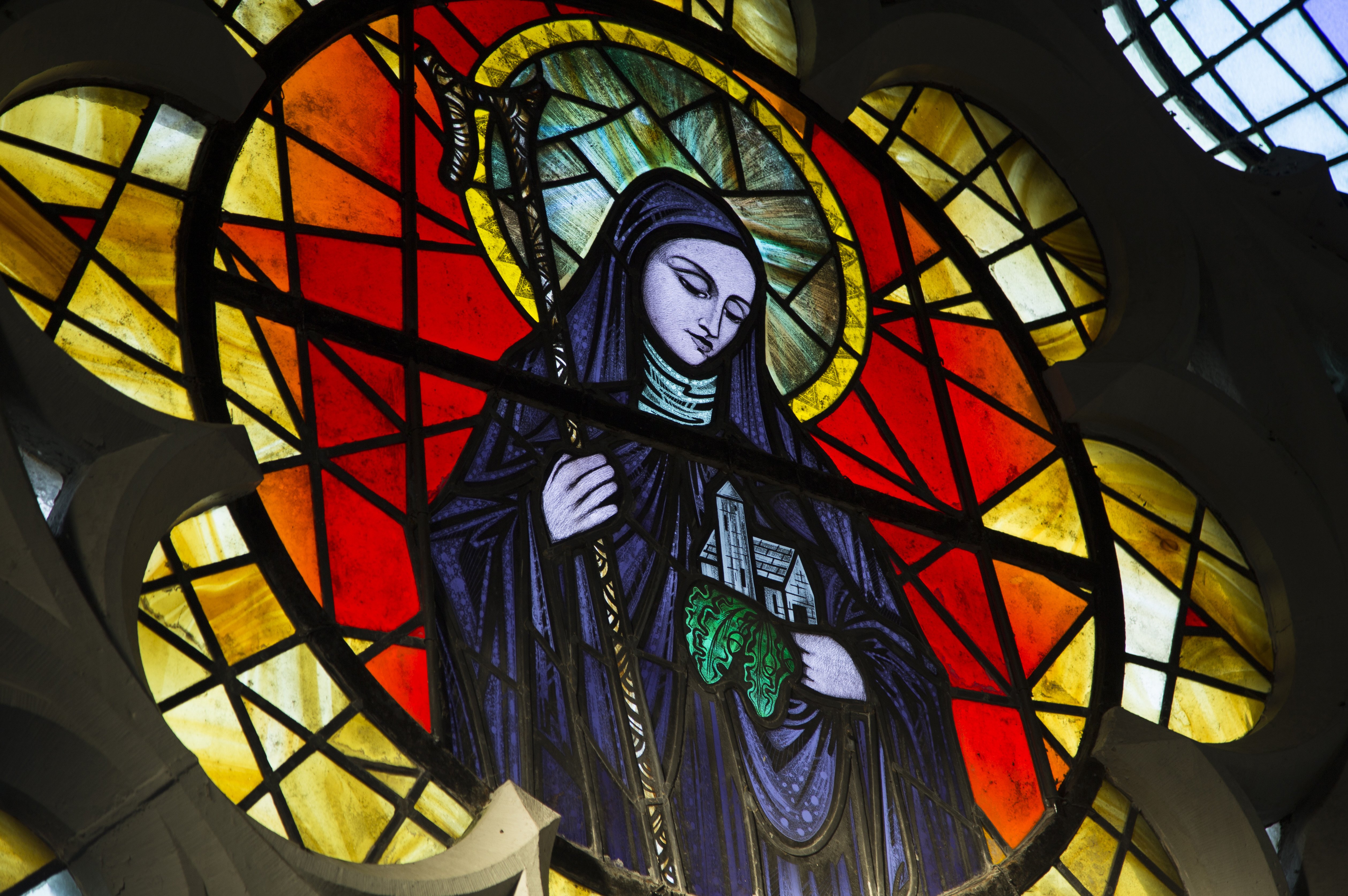 St. Brigid of Kildare is pictured in a stained-glass window in St. Brigid's Church Jan. 20 in Crosshaven, a village in County Cork, Ireland. (CNS/Cillian Kelly)