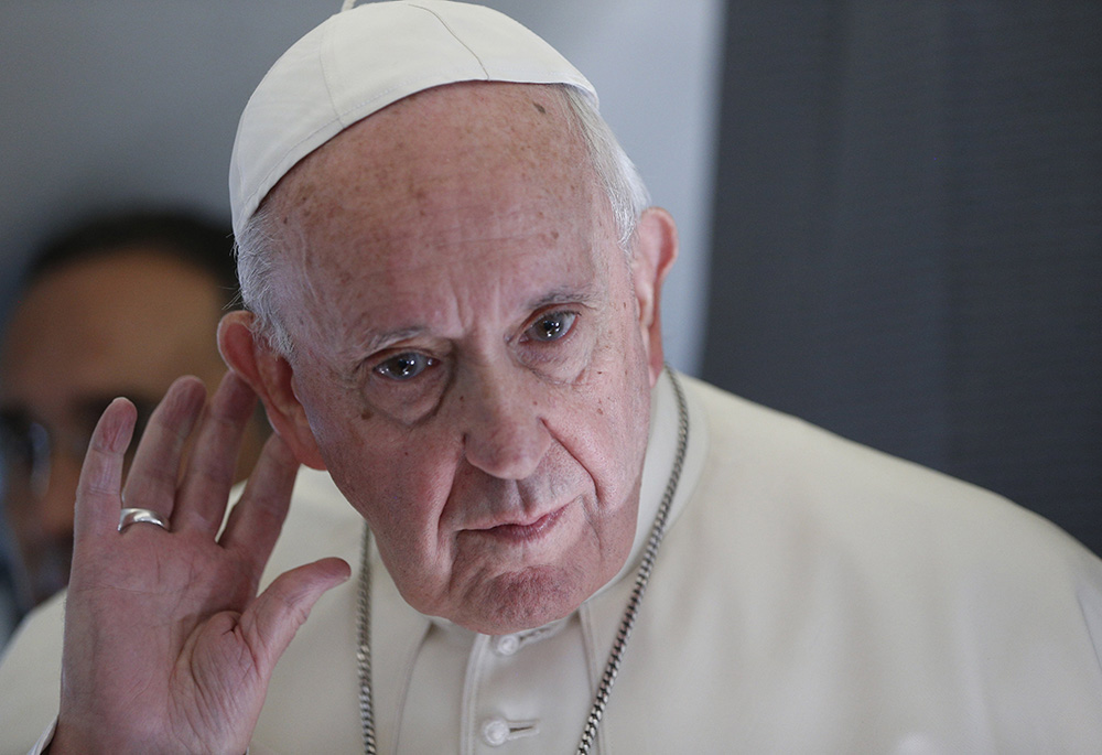 Pope Francis listens to a question while responding to journalists aboard his flight from Tallinn, Estonia, to Rome in this Sept. 25, 2018, file photo. (CNS/Paul Haring) Pope Francis listens to a question while responding to journalists aboard his flight from Tallinn, Estonia, to Rome in this Sept. 25, 2018, file photo. (CNS/Paul Haring)