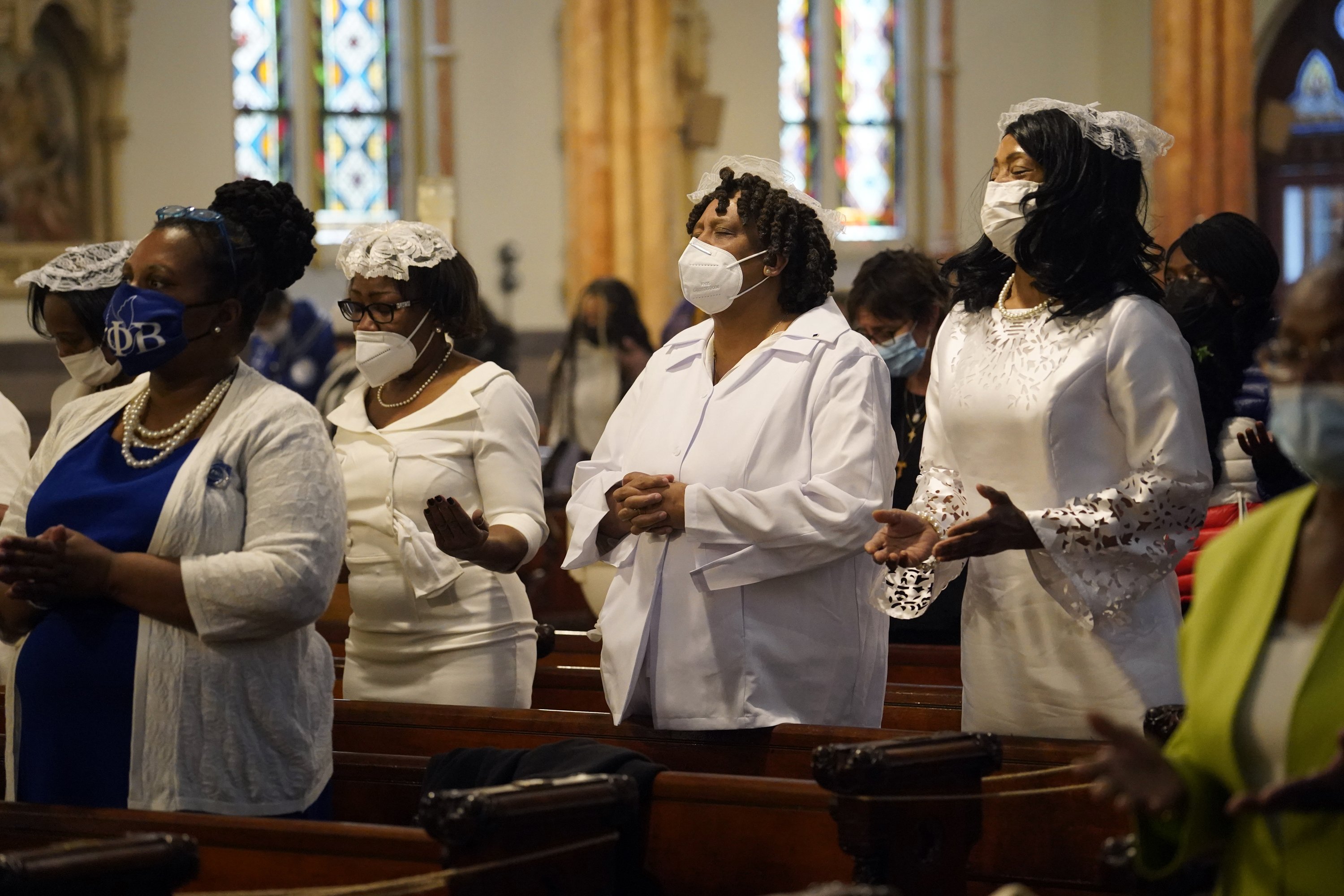 Members of the Ladies Auxiliary of the Knights of Peter Claver pray during a Mass marking Black Catholic History Month Nov. 21, 2021, at Our Lady of Victory Church in the Bedford-Stuyvesant section of Brooklyn, N.Y. (CNS photo/Gregory A. Shemitz)