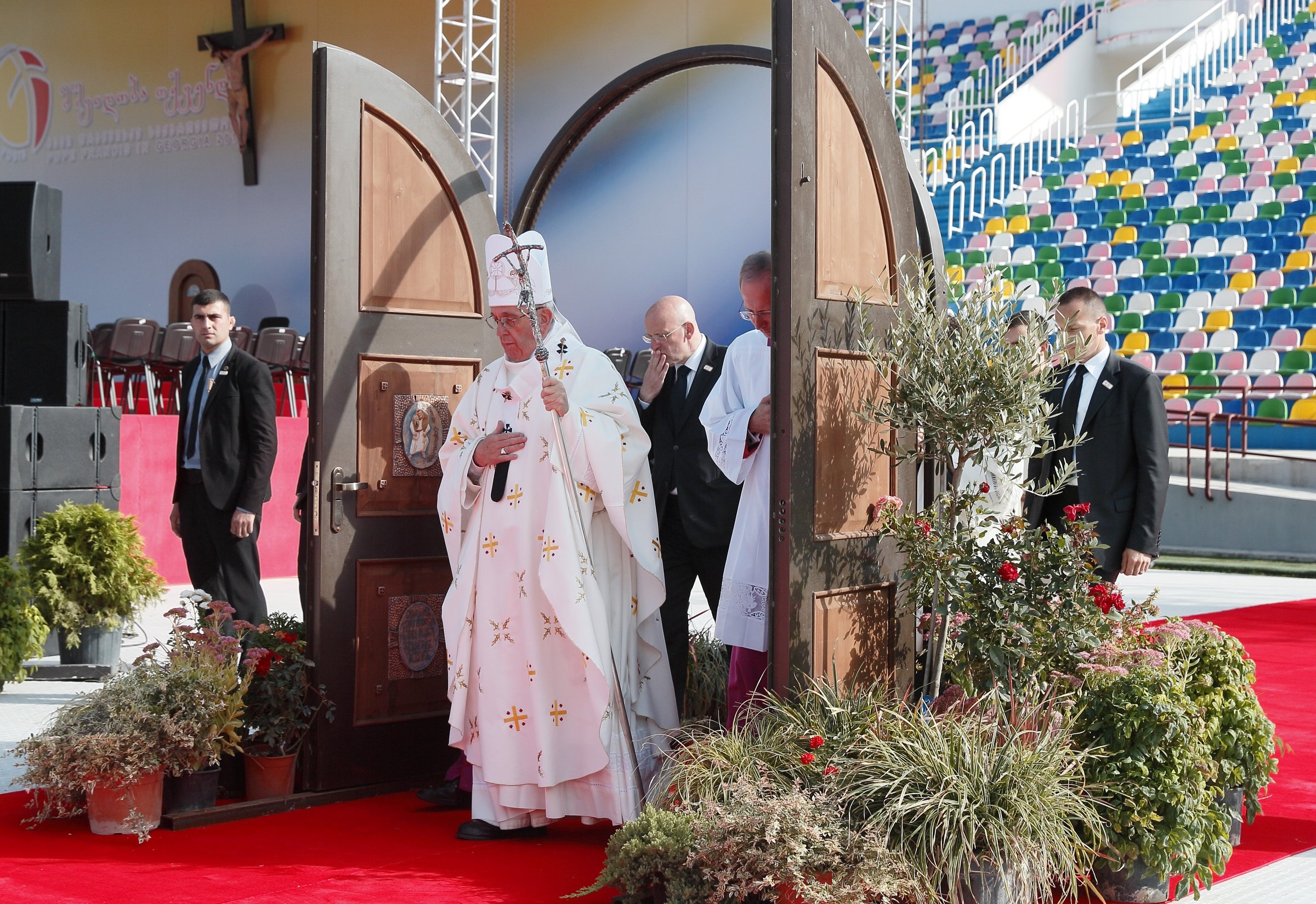 Pope Francis walks through a Holy Door as he arrives to celebrate Mass at Mikheil Meskhi Stadium in Tbilisi, Georgia, in this Oct. 1, 2016. (CNS photo/Paul Haring)