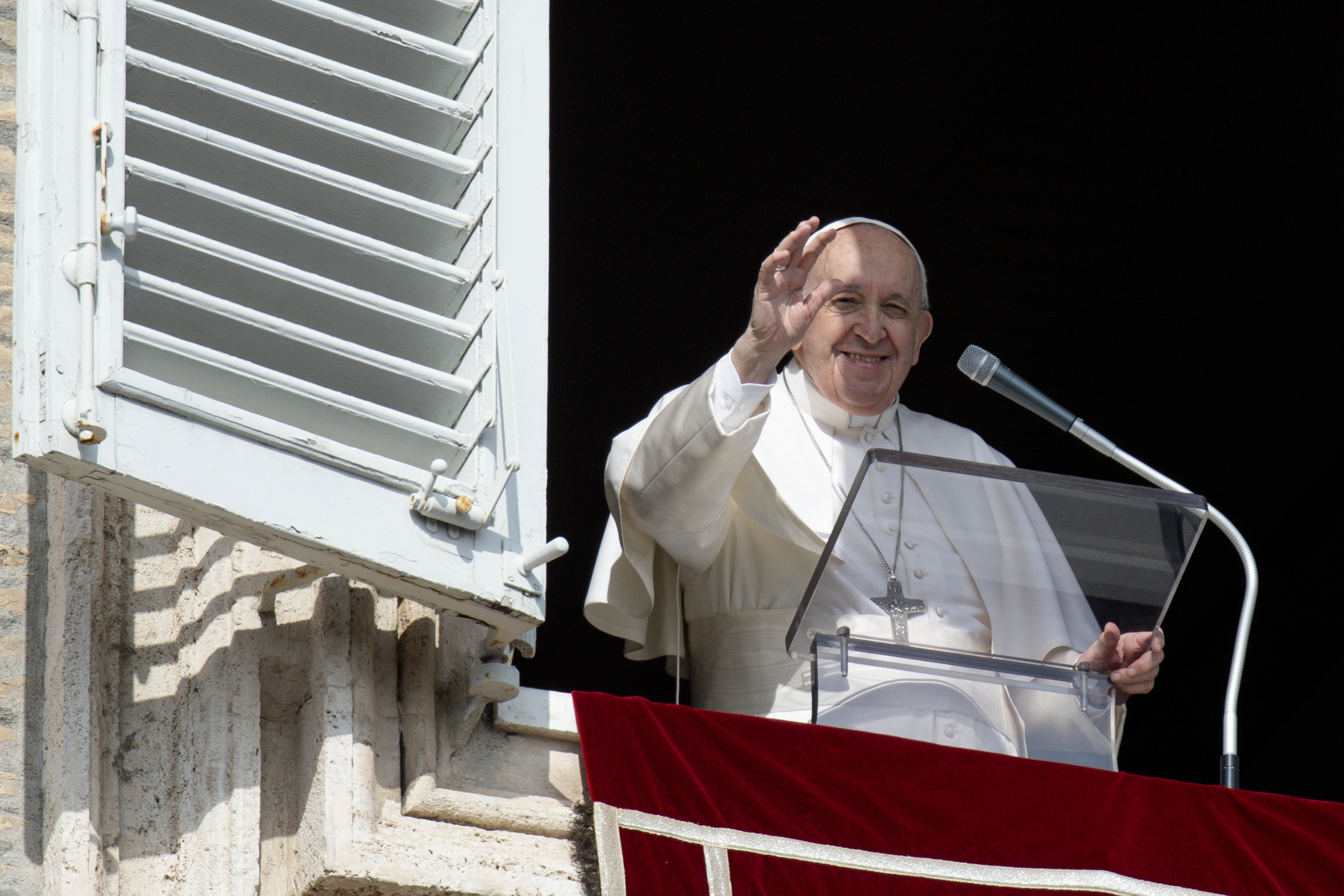 Pope Francis greets the crowd as he leads the Angelus from the window of his studio overlooking St. Peter's Square at the Vatican Feb. 13, 2022. (CNS photo/Vatican Media)