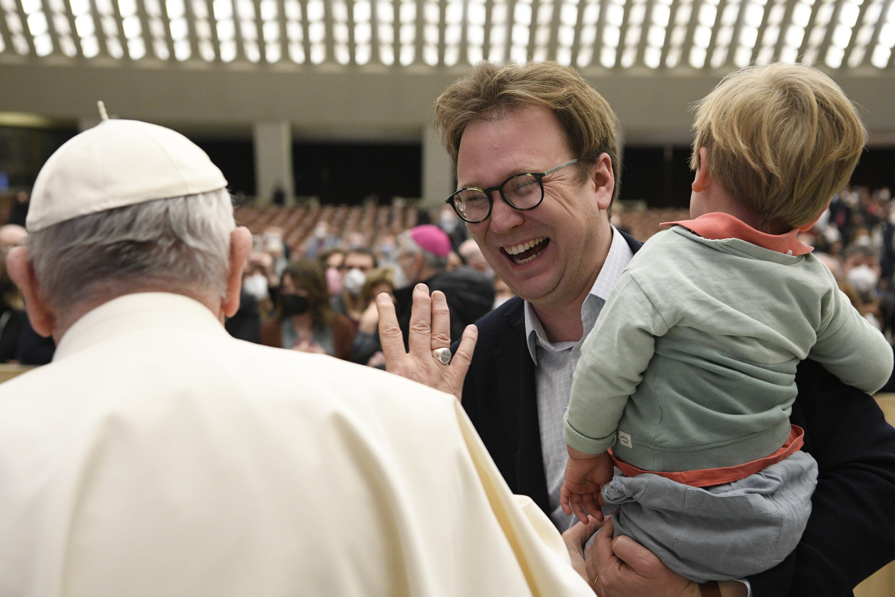 Pope Francis greets Christopher Lamb, Rome correspondent for The Tablet, during his general audience in the Paul VI hall at the Vatican Feb. 16, 2022. (CNS photo/Vatican Media)