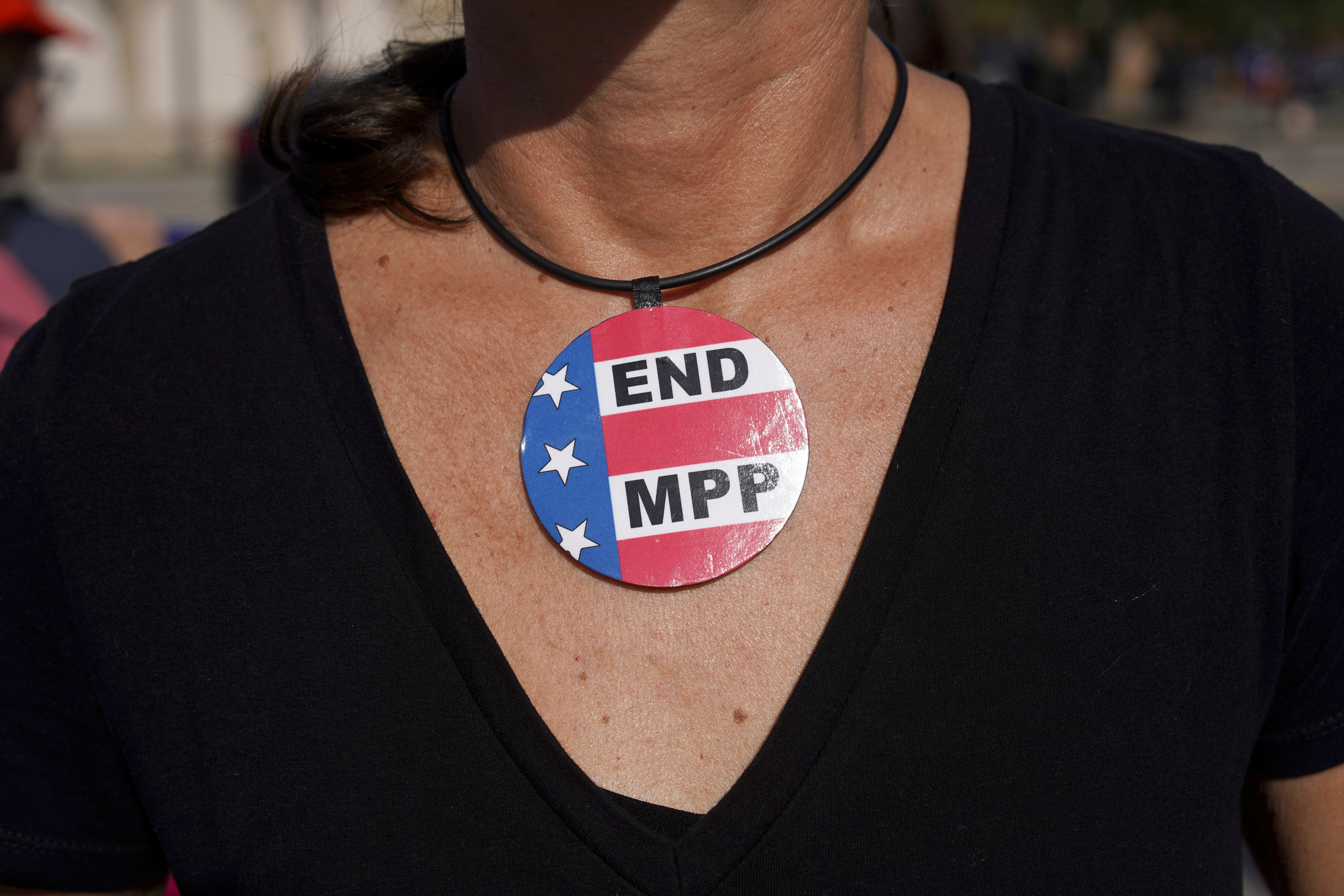 A demonstrator outside a U.S. Customs and Border Protection building in Brownsville, Texas, wears a necklace that reads "END MPP," to protest against Migrant Protection Protocols Jan. 12, 2020. (CNS photo/Go Nakamura, Reuters)