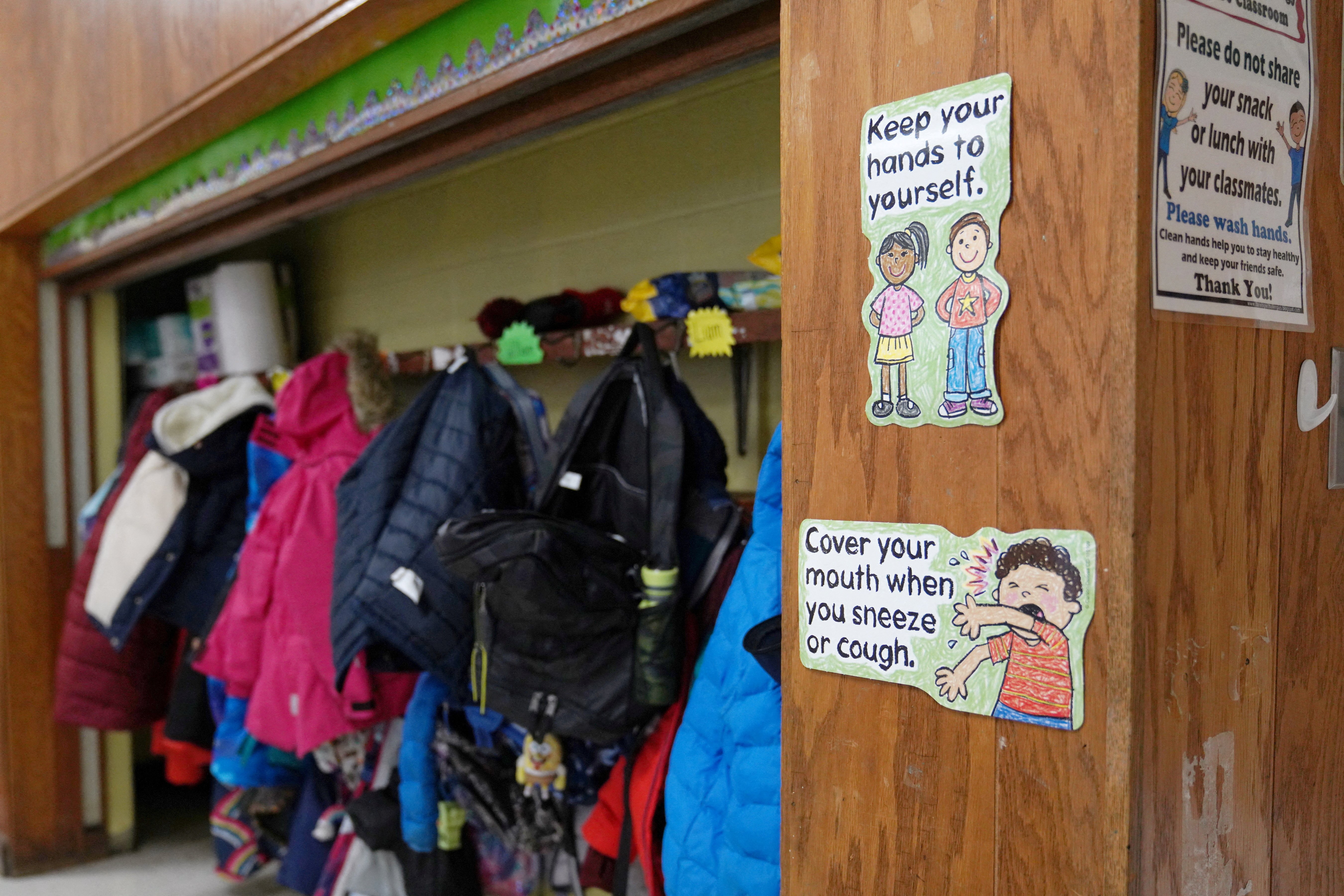 Signs at South Boston Catholic Academy in Boston remind children of precautions to prevent the spread of COVID-19 in the classroom Jan. 28, 2021. (CNS photo/Allison Dinner, Reuters)
