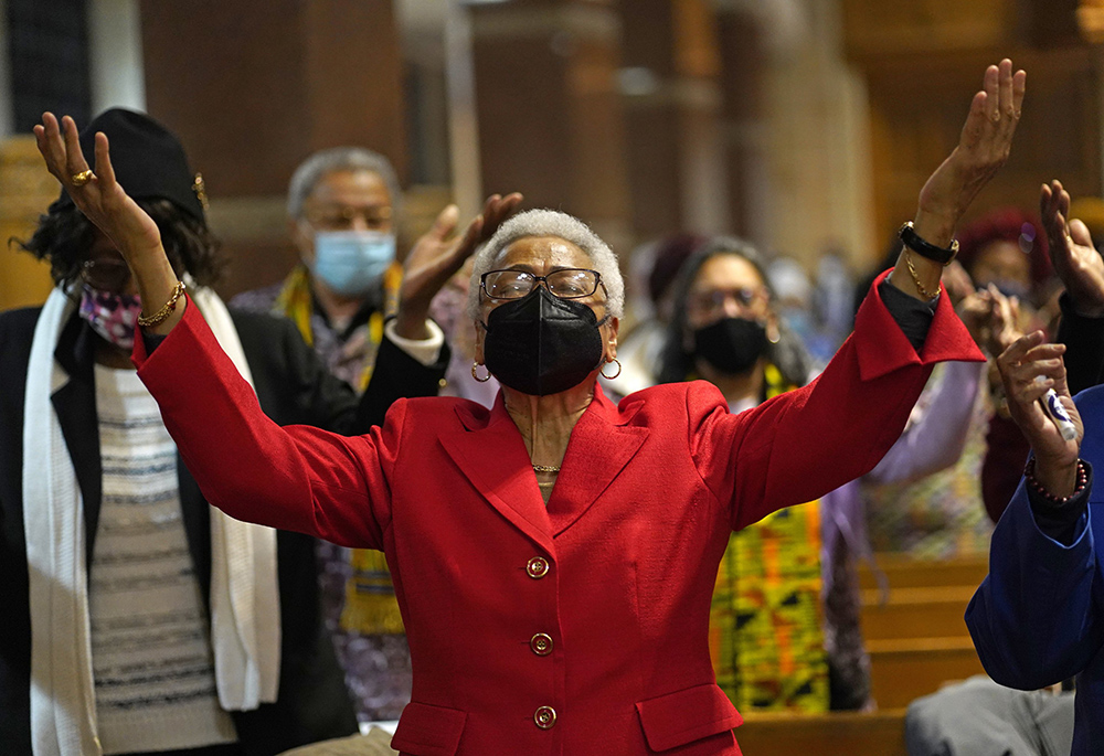 A woman prays during a Black History Month Mass of thanksgiving at Immaculate Conception Church in the Jamaica Estates section of the New York borough of Queens Feb. 20. (CNS/Gregory A. Shemitz)